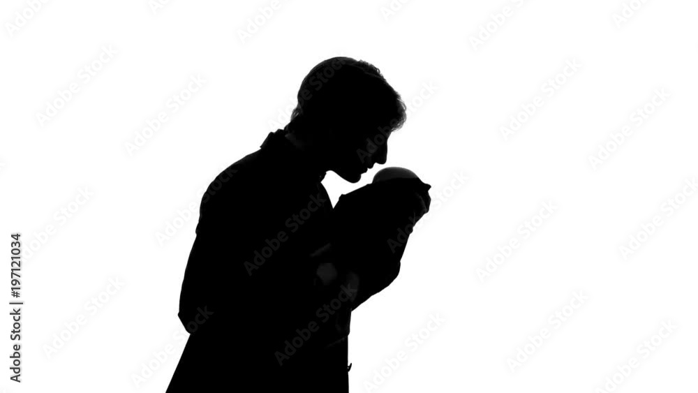 Single father holding his newborn son, kissing baby forehead, loving heartily Single father holding his newborn son, kissing baby forehead, loving heartily