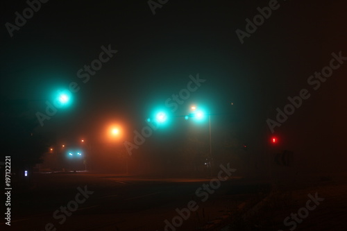 Misty road and traffic lights