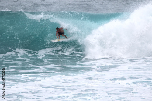 Man riding in the barrel at Honolua Bay on Maui.