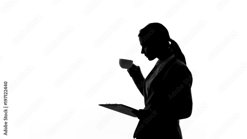Lady boss drinking coffee, reading document folder, business decision making Lady boss drinking coffee, reading document folder, business decision making