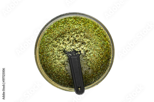 isolated Kief in grinder for weed Trichomes buds of Cannabis macro top view photo