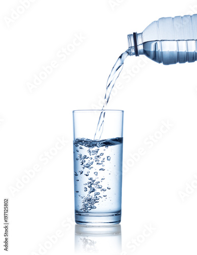 Wallpaper Mural pouring water on a glass isolated on white background. Clipping path Torontodigital.ca