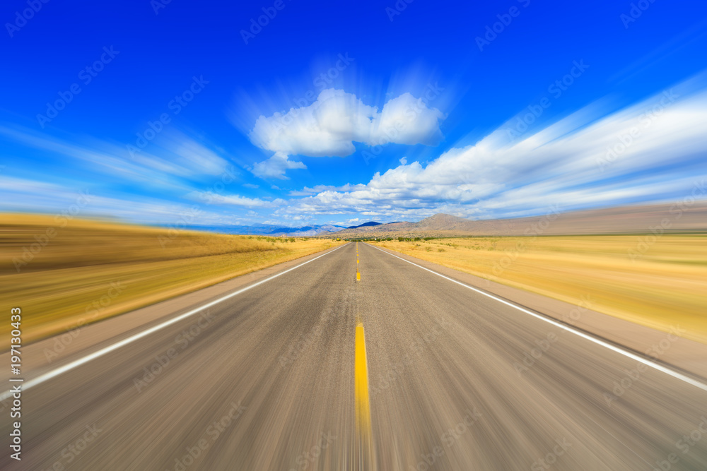 Two lane desert highway with motion blur