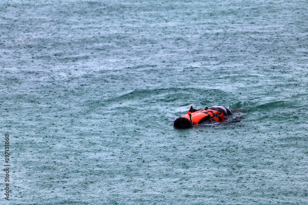 Tourists enjoy activities while raining,snorkeling near the beach,Rainy season in Thailand Tourists enjoy activities while raining,snorkeling near the beach,Rainy season in Thailand
