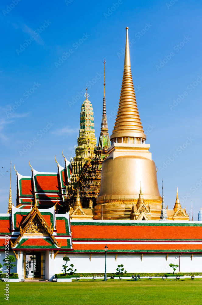 Naklejka premium Wat Phra Kaeo, Temple of the Emerald Buddha and the home of the Thai King. Wat Phra Kaeo is one of Bangkok's most famous tourist sites and it was built in 1782 at Bangkok, Thailand.
