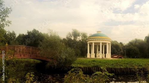 wooden bridge and rotunda in the park timelapse