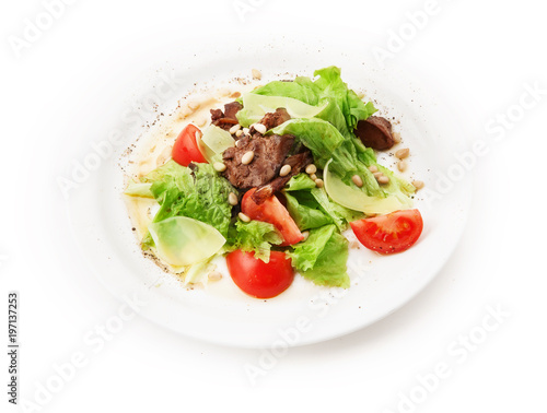 Salad from meat, cheese, tomato, pinienkernen and salad leafs on white background