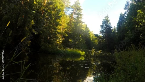 white clouds over the river in forest timelapse