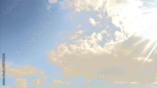 sun and white clouds in the blue sky timelapse