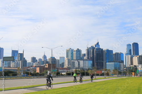 Cyclists and Melbourne cityscape Australia