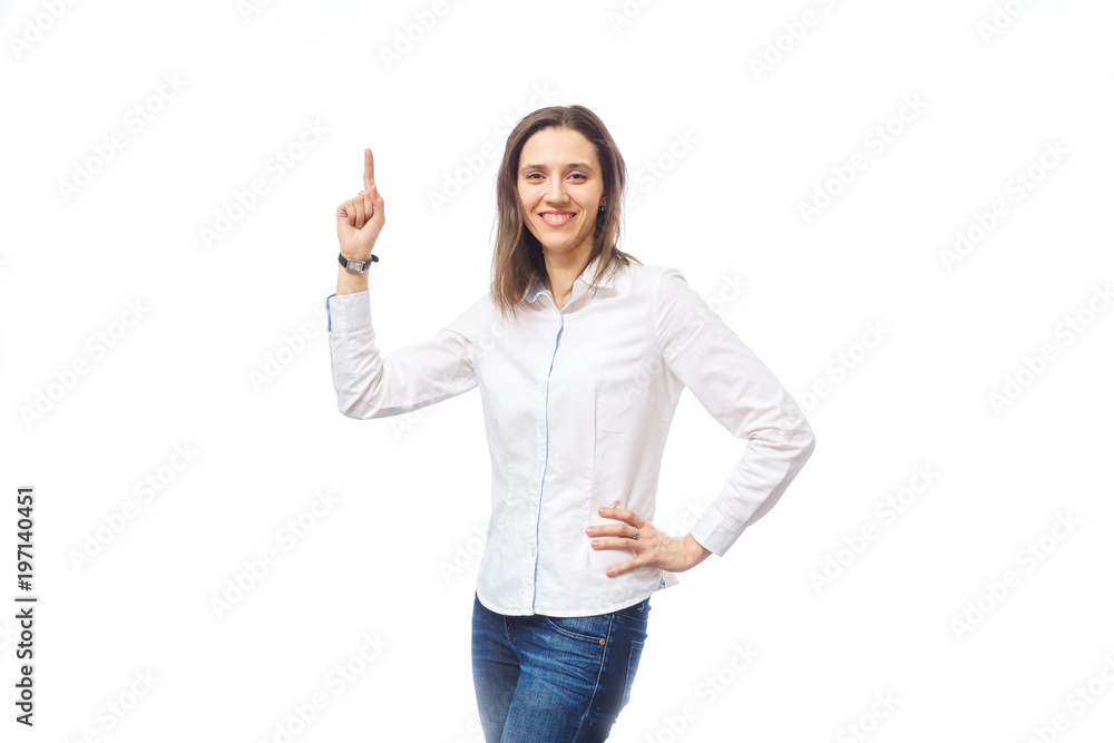 beautiful woman showing a finger at something, on a white background in the studio beautiful woman showing a finger at something, on a white background in the studio