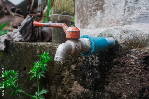 Wallpaper Mural dripping water on an old faucet. Torontodigital.ca