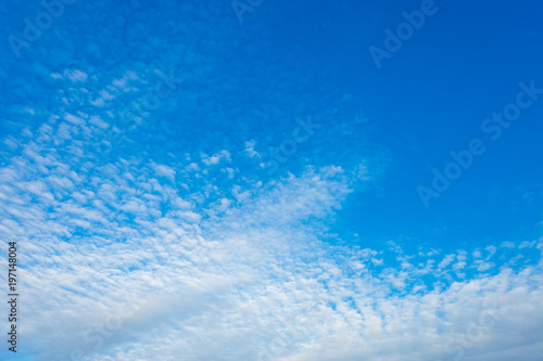 blue sky background with white clouds © Thinapob
