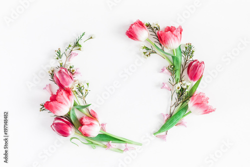 Flowers composition. Wreath made of pink tulip flowers on white background. Flat lay, top view, copy space