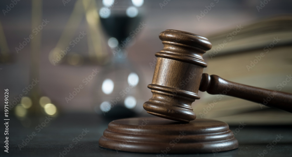 Law and Justice concept. Gavel of the judge, books, scales of justice. Brown background, Courtroom theme. Law and Justice concept. Gavel of the judge, books, scales of justice. Brown background, Courtroom theme.