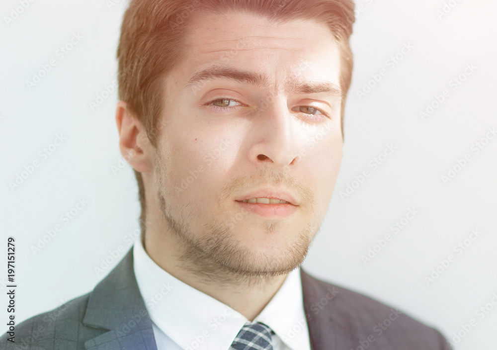 closeup.the face of a successful young man closeup.the face of a successful young man