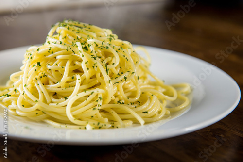 Cooked Italian spaghetti seasoning with ground parsley