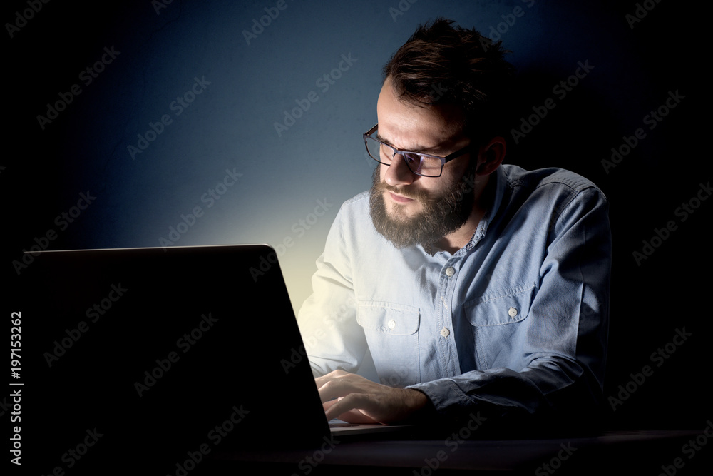 Businessman in the office at night
