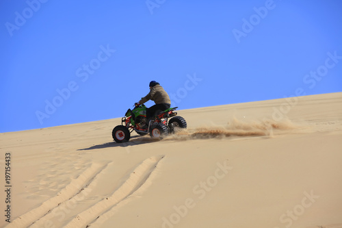 Cross-country motorcycle driving in the desert