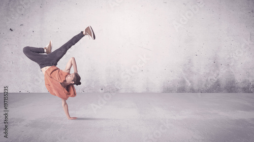 Pretty urban dancer with empty background