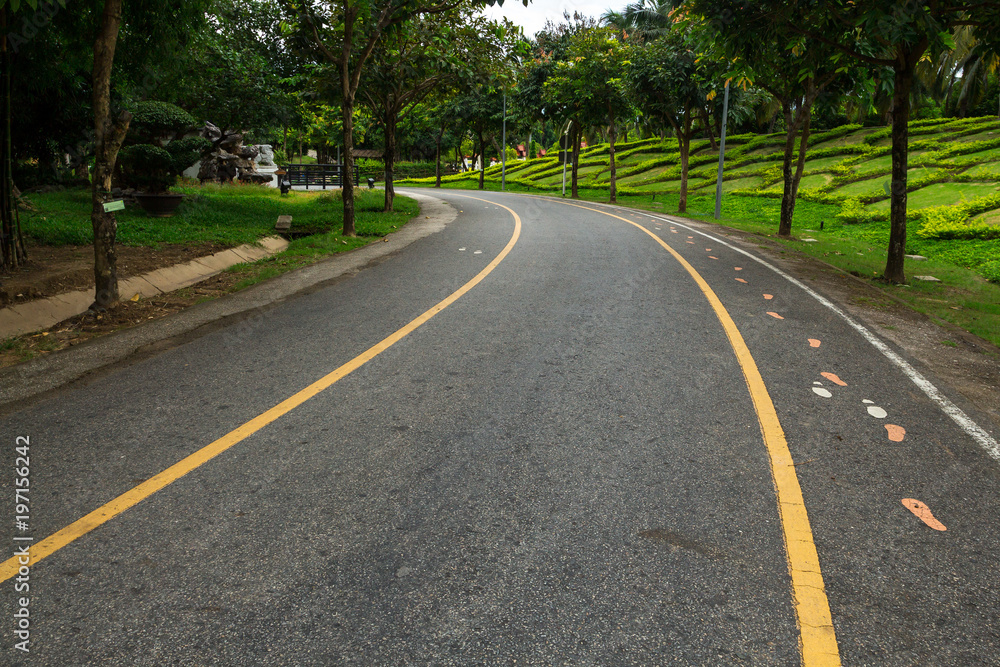 Road pathway Jogging track in the park for relaxing walking jogging or ride bicycle and exercise. Road pathway Jogging track in the park for relaxing walking jogging or ride bicycle and exercise.