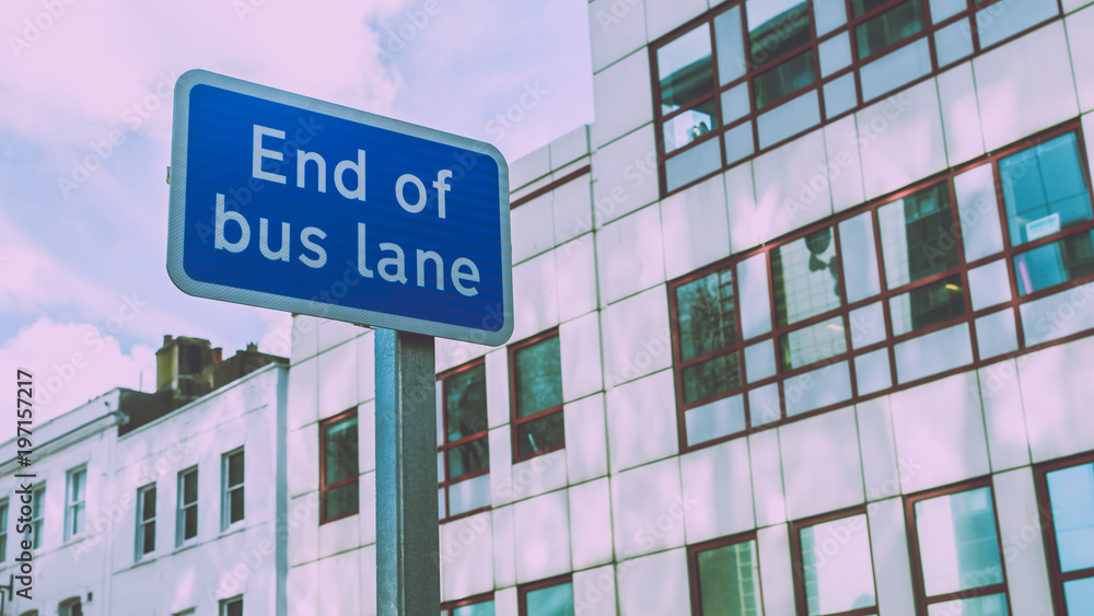 End of Bus Lane Sign with Modern Building in background, split toning shallow depth of field horizontal photography End of Bus Lane Sign with Modern Building in background, split toning shallow depth of field horizontal photography