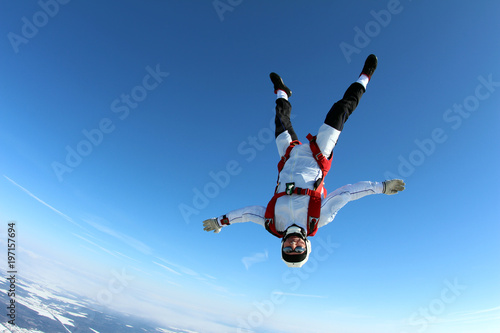 Skydiver is flying head down position.