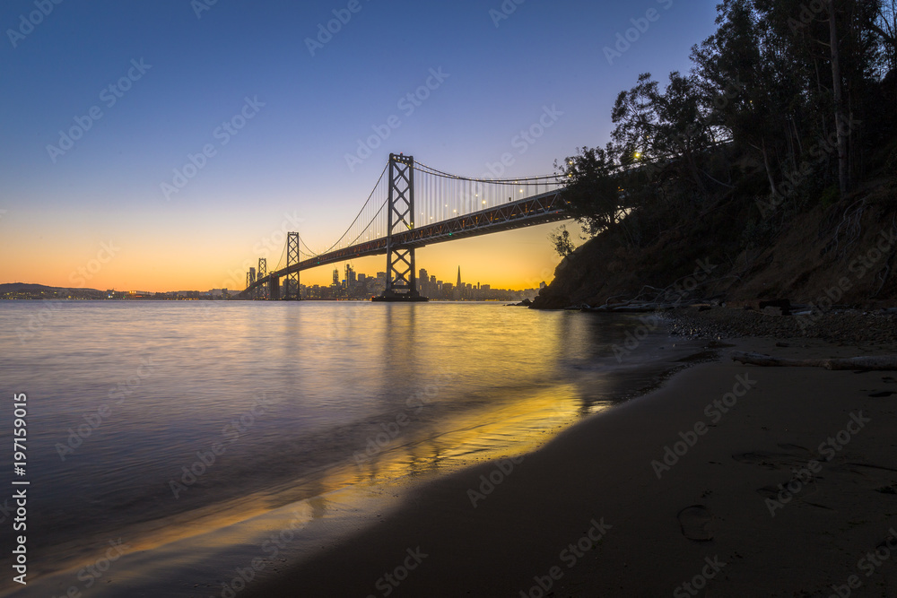 San Francisco skyline with Oakland Bay Bridge in twilight, California, USA San Francisco skyline with Oakland Bay Bridge in twilight, California, USA