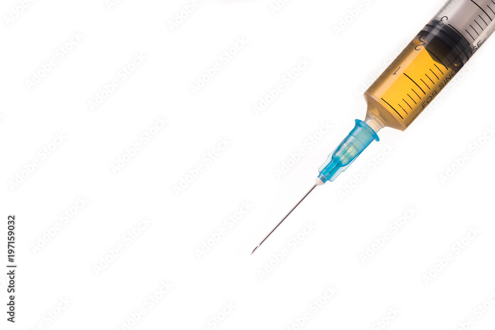 syringe with brown liquid syringe with brown liquid