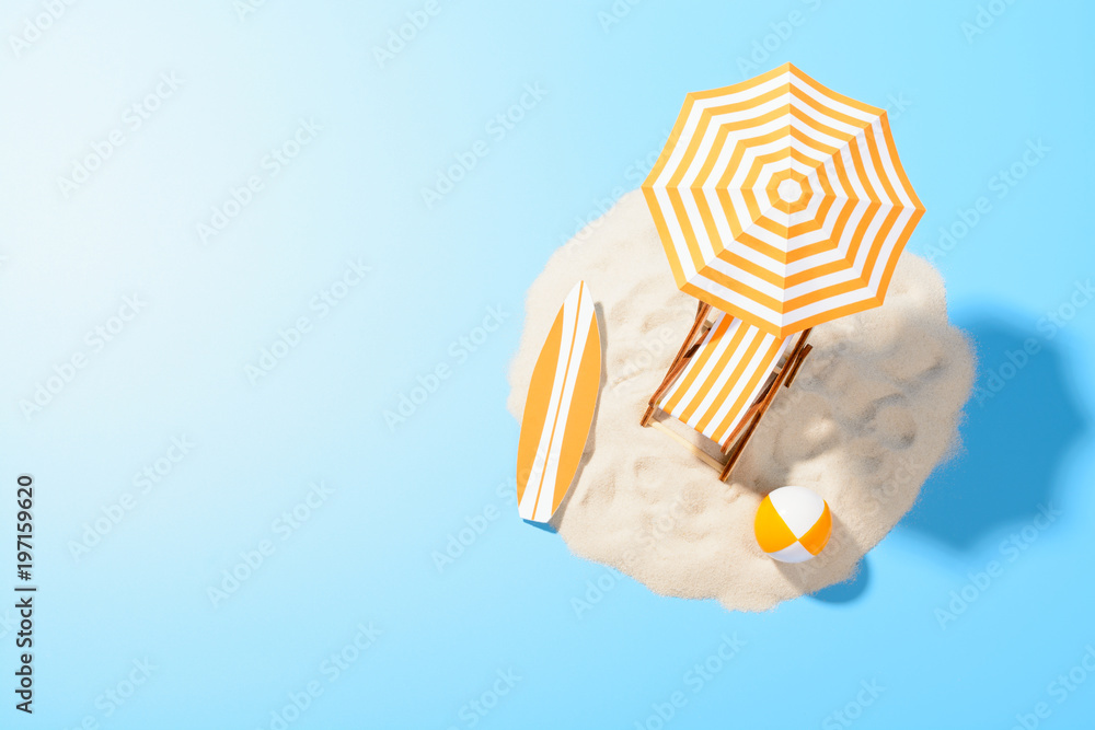 Obraz premium Tropical vacation background. Sun lounger with umbrella and beach accessories for active rest on the sandy island, copy space, top view
