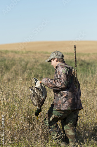 A Duck Hunter with a Drake Mallard in Norh Dakota photo