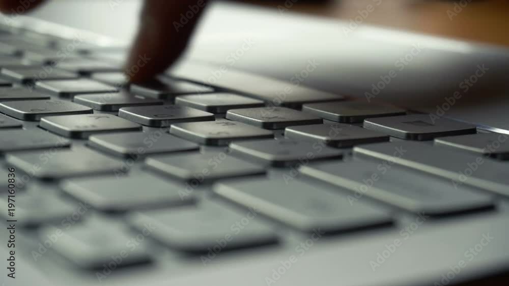 Laptop keyboard typing. Close up shot of hands touch typing on a laptop