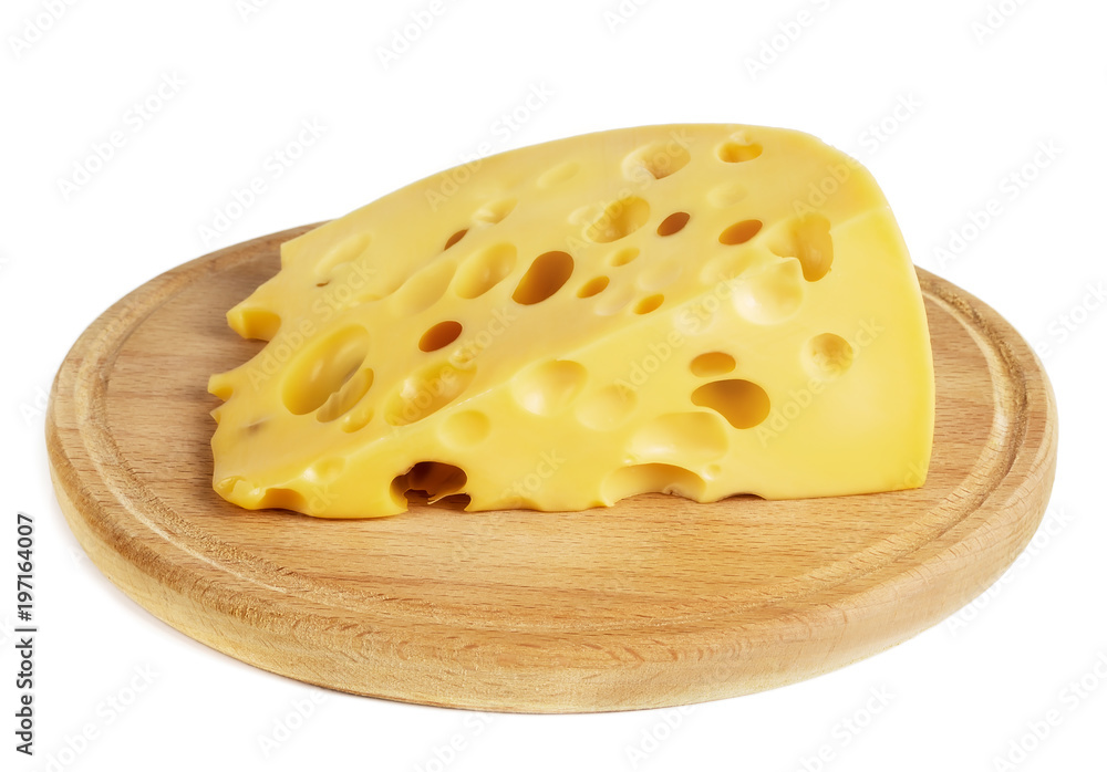 a piece of cheese with large holes lies on the board