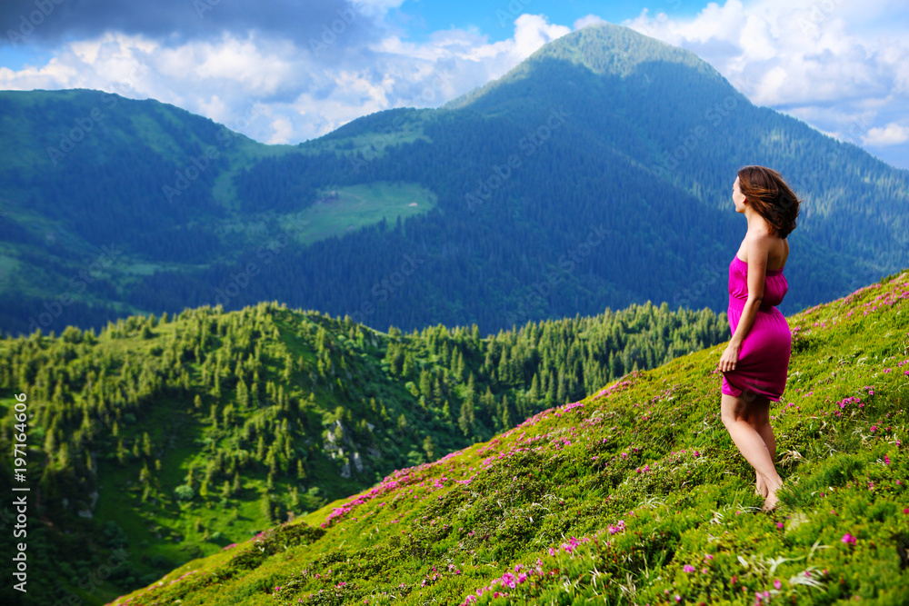 The girl enjoys landscapes in the mountains of the Carpathians. The girl enjoys landscapes in the mountains of the Carpathians.