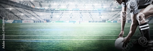 Composite image of rugby player holding ball while bending