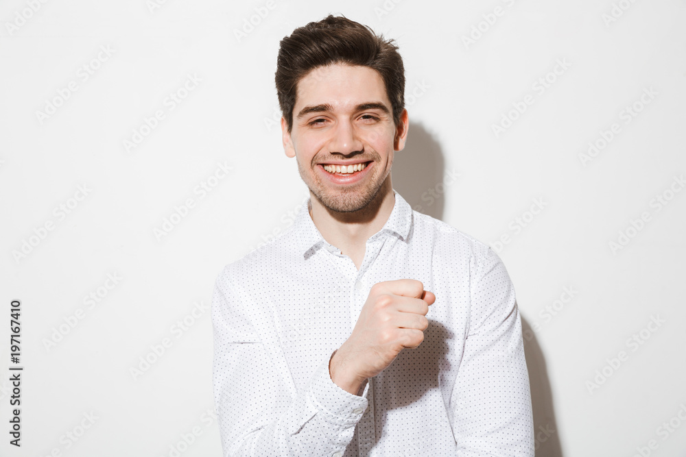 Portrait of a smiling young man dressed in shirt Portrait of a smiling young man dressed in shirt