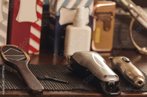 The machine for a hairstyle with attachments, comb and scissors. Hair clippers in barbershop.