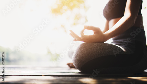 young women meditate while doing yoga in atmosphere peaceful.