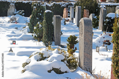 graveyard on a sunny winter day with snow