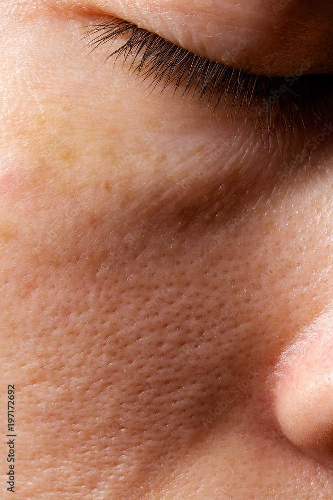 Face skin of young lady between 30 and 35 years old. Closeup Face skin of young lady between 30 and 35 years old. Closeup