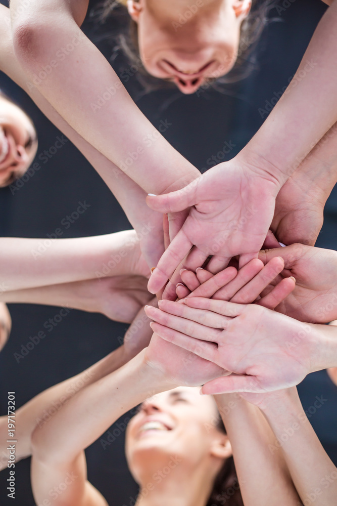 Super Teamwork. Multiracial Group of Friends with Hands in Stack.