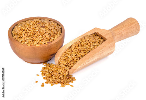 Schilderij op canvas Golden flax seeds on a white background