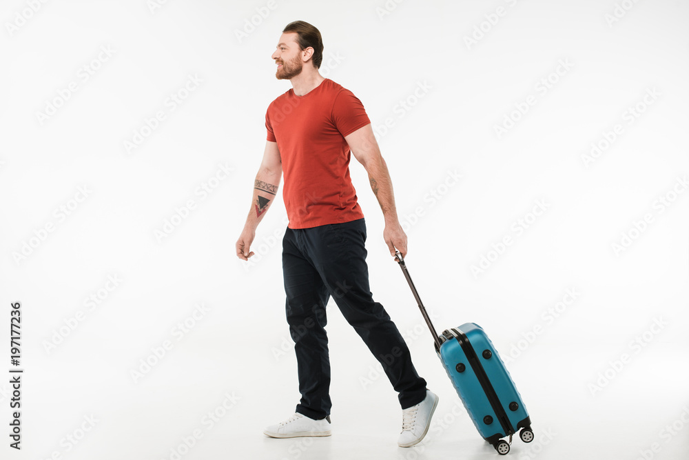 Man carrying suitcase isolated on white, travel concept Man carrying suitcase isolated on white, travel concept