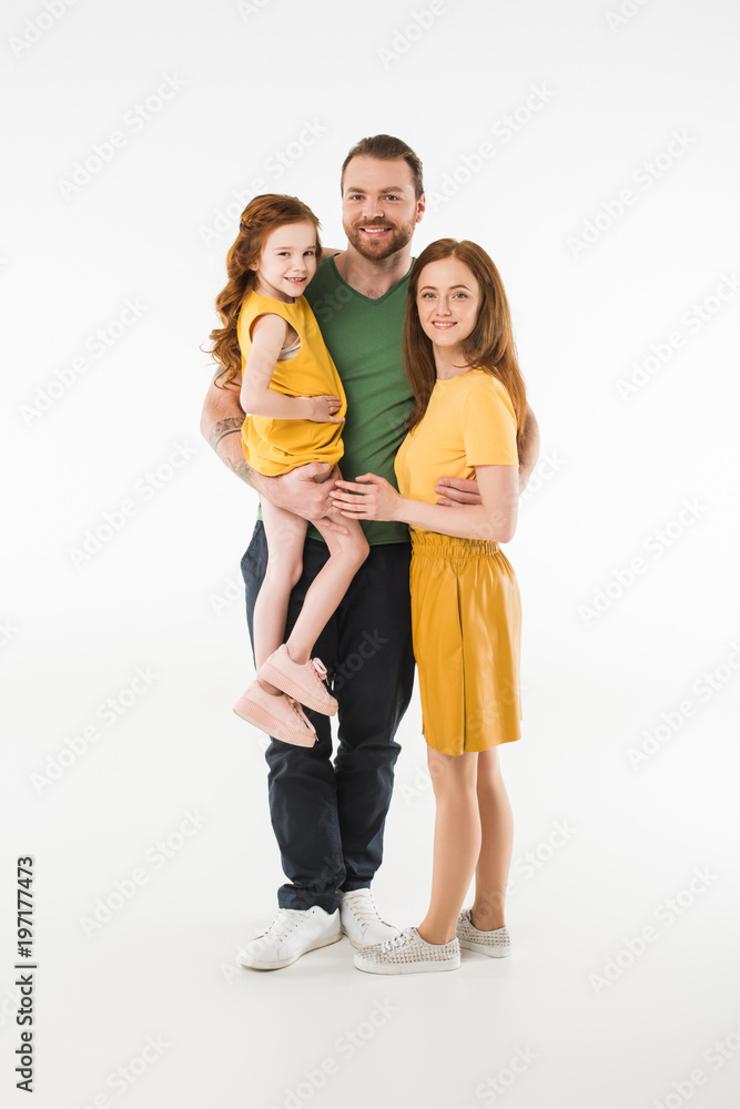 Happy stylish family standing isolated on white Happy stylish family standing isolated on white