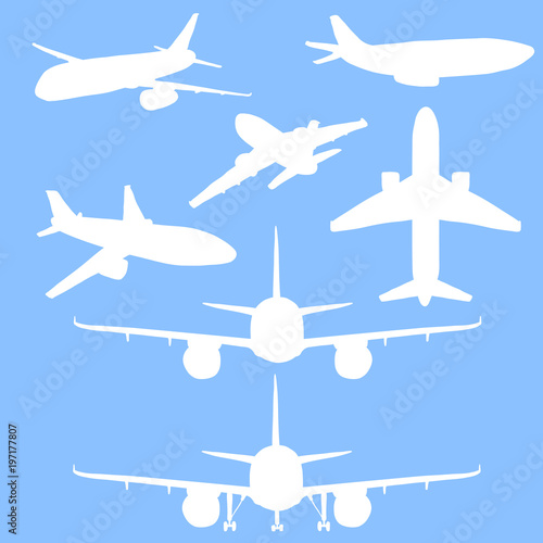 Vector Set of White Silhouette Passenger Planes on Blue Background.