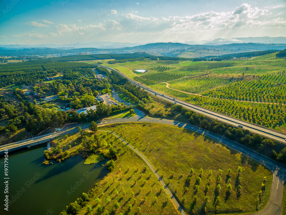 Aerial view of Tuggeranong Parkway passing near National Arboretum in Canberra, Australia