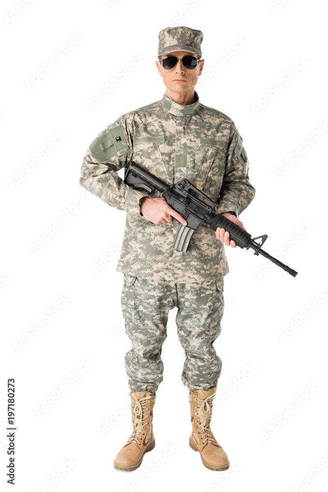 Army soldier in uniform holding gun isolated on white Army soldier in uniform holding gun isolated on white