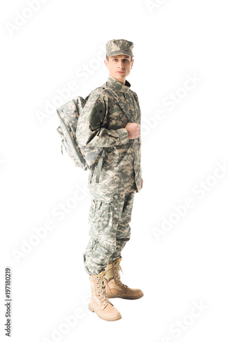 Handsome army soldier in uniform holding backpack isolated on white