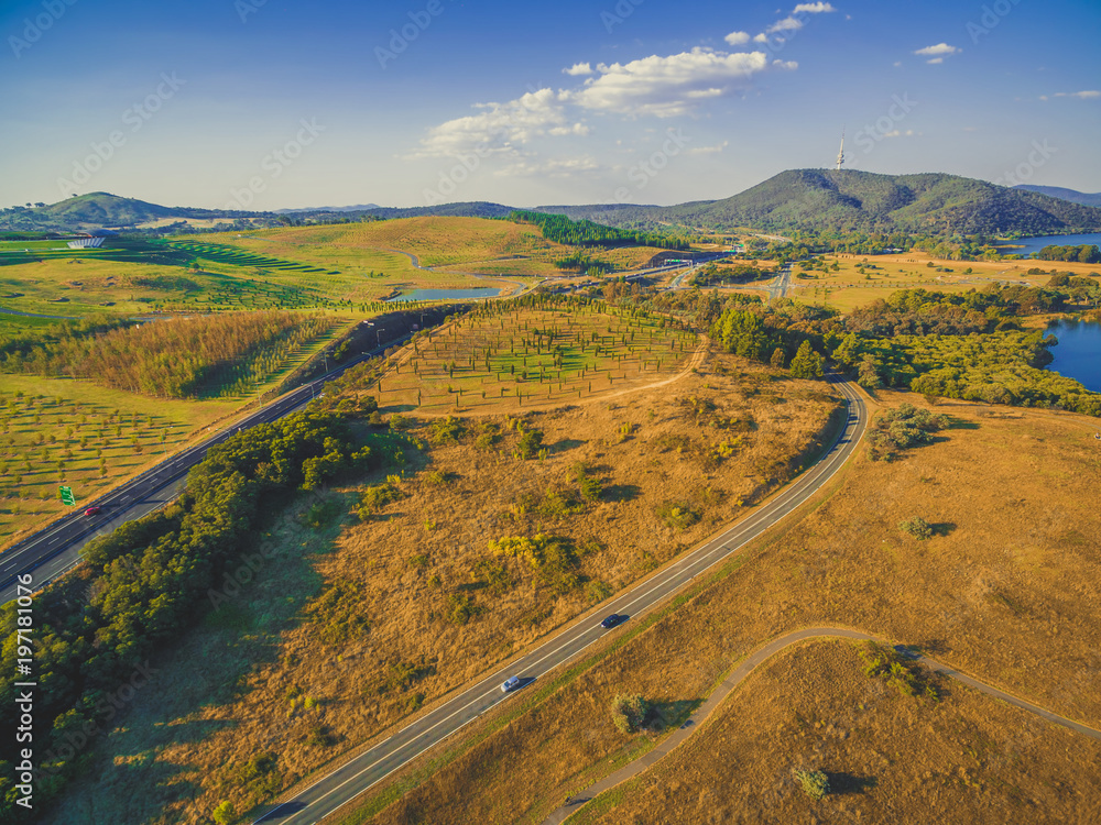 Aerial view of Tuggeranong Parkway and Lady Denman drive with iconic Telstra tower on the horizon. Canberra, Australia