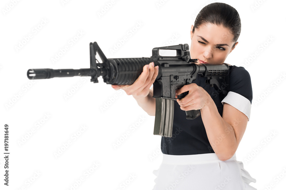 Brunette woman in maid uniform aiming gun isolated on white